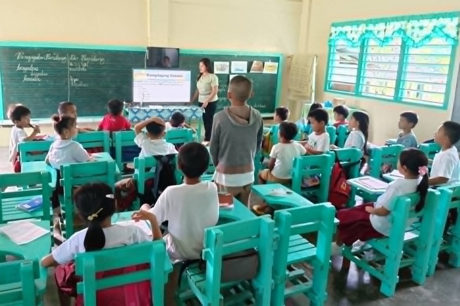 Judy Ann Yatan, one of four teachers who returned to her hometown